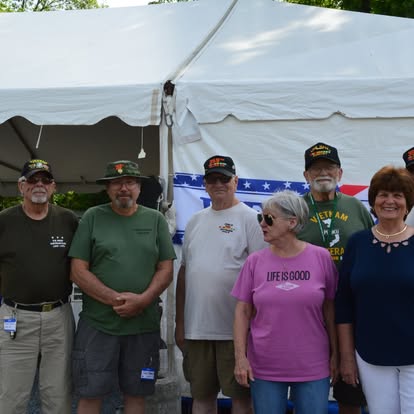 Veterans and friends gathered at the reunion tent